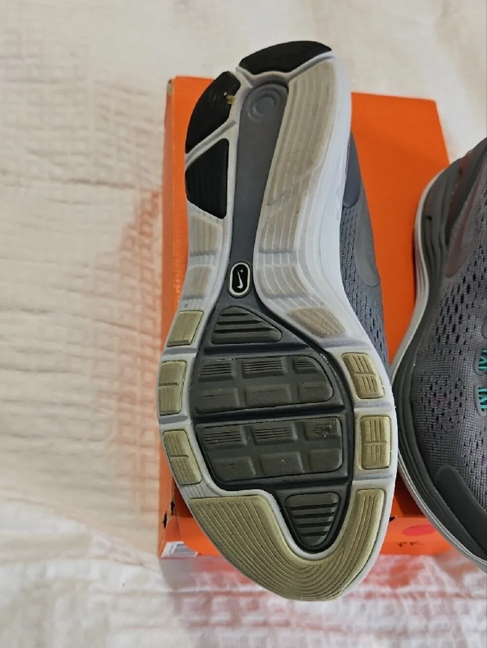 Nike Women’s Gray Athletic Shoes with Purple and Teal Accents